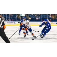 Syracuse Crunch defenseman Simon Lundmark (right) vs. the Bridgeport Islanders