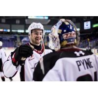 Vancouver Giants exchange congratulations after a win