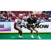 Oshawa Firewolves defender Nick Chaykowsky (left) vs. the Vancouver Warriors