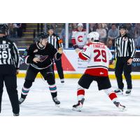 Kelowna Rockets left wing Dawson Gerwing (left) vs. the Prince George Cougars