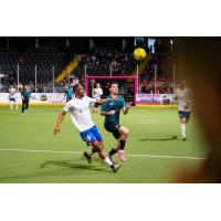 St. Louis Ambush vies for the ball against the Kansas City Comets