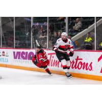 Belleville Senators centre Garrett Pilon (right) vs. the Utica Comets