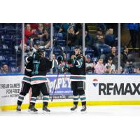Kelowna Rockets exchange fist bumps following a goal