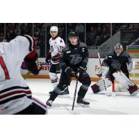 Peterborough Petes defenceman Carson Cameron sets up in front of goaltender Easton Rye